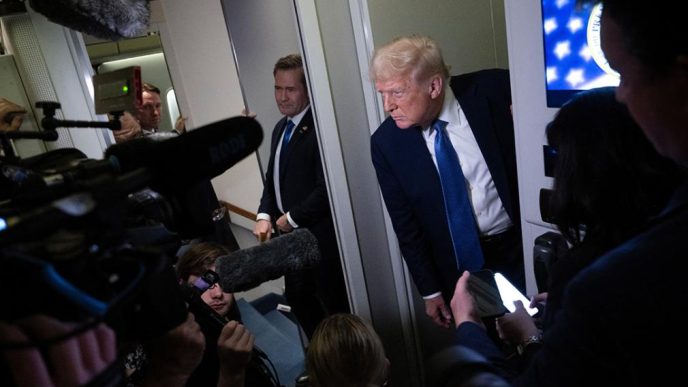 CAP/ President Donald Trump speaks to reporters aboard Air Force One above Virginia while flying to Washington, D.C., from Florida on March 16.