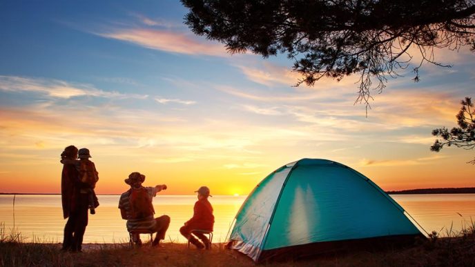 Campers enjoy a sunset view.