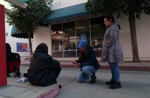 During the 2025 point-in-time count, participants speak to a person possibly experiencing homelessness.
